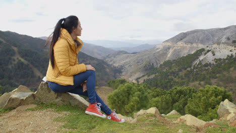 Calm-woman-looking-into-valley