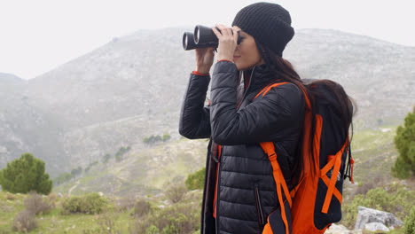 Happy-smiling-woman-enjoying-a-misty-hike