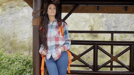 Young-female-hiker-relaxing-at-a-mountain-lookout