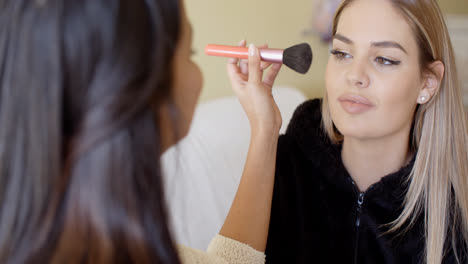 Female-cosmetician-working-with-client