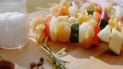 Four-chicken-and-vegetable-kabobs-on-cutting-board