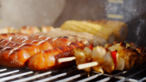 Sausages--corncobs-and-kebabs-grilling-on-a-BBQ