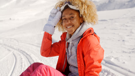 Close-up-of-cheerful-woman-on-snowy-hill