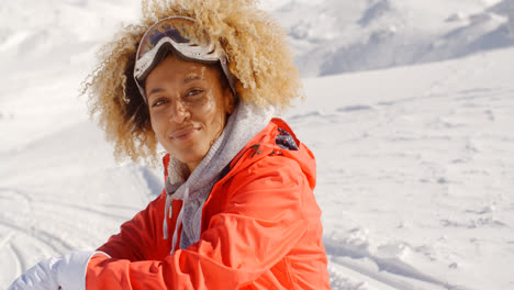 Close-up-of-cheerful-woman-on-snowy-hill