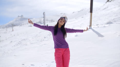 Happy-young-woman-embracing-the-winter-sun