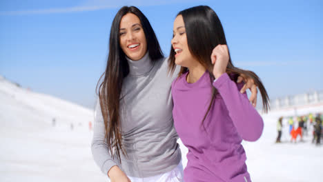 Laughing-vivacious-young-women-at-a-ski-resort