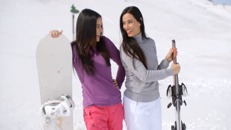 Two-attractive-female-friends-at-a-ski-resort