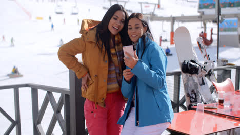 Two-young-woman-checking-out-a-selfie