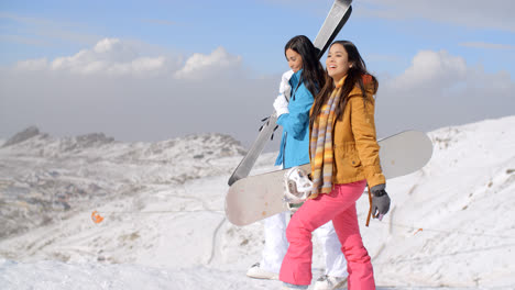 Two-friends-hiking-up-ski-slope