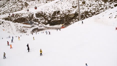 View-from-a-ski-lift-of-skiers-below-on-a-run