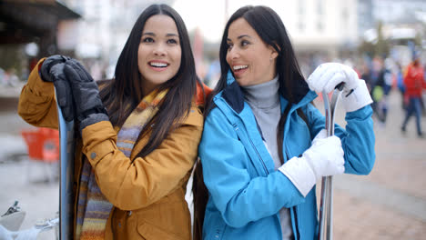 Two-gorgeous-young-brunette-snowboarders