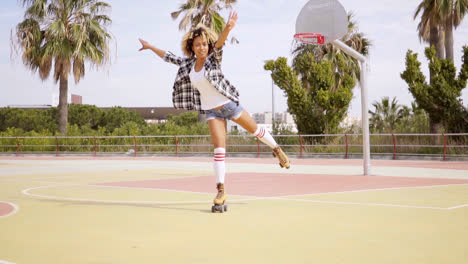 Sporty-young-woman-enjoying-herself-roller-skating