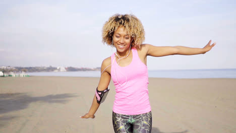 Playful-young-carefree-fit-adult-at-beach