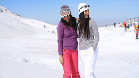 Two-attractive-women-friends-at-a-ski-resort