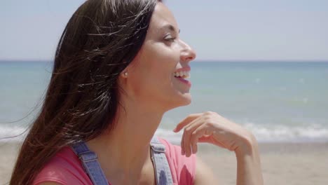 Close-up-of-happy-lady-with-ocean-background