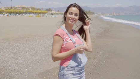 Front-view-on-lady-walking-along-beach