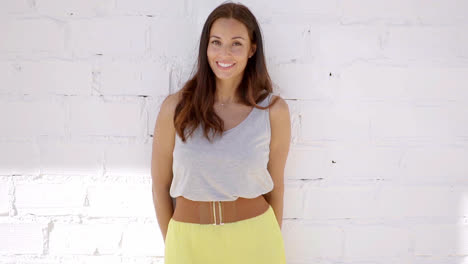 Adorable-and-sensual-woman-posing-against-wall