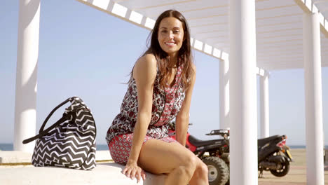 Happy-relaxed-trendy-young-woman-at-the-beach