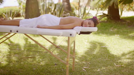 Young-woman-at-a-tropical-outdoor-spa