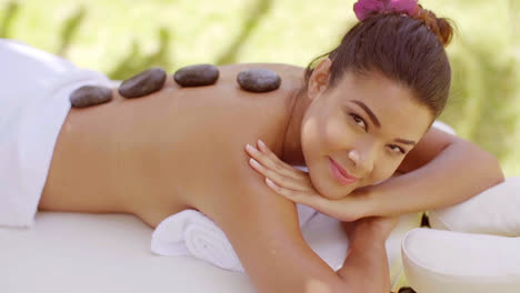 Pretty-young-woman-having-a-hot-stone-massage