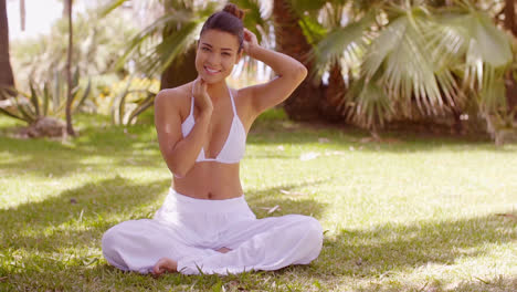 Gorgeous-sexy-young-woman-sitting-on-the-grass