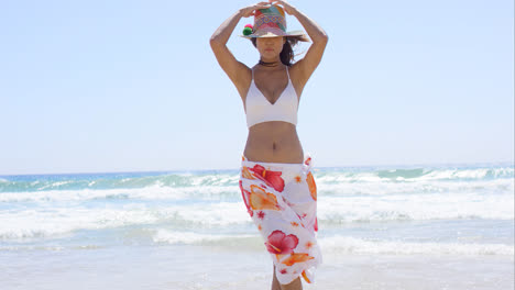 Sexy-young-woman-posing-on-a-tropical-beach