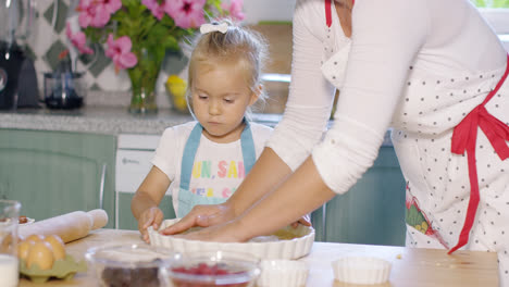 Mother-and-daughter-baking-a-homemade-pie