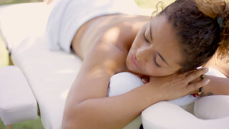 Top-down-view-of-woman-on-massage-table