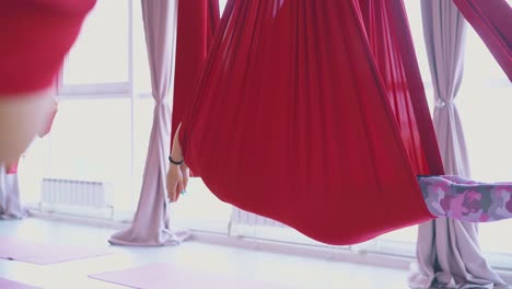 red-aerial-fly-yoga-hammocks-support-relaxed-women-bodies