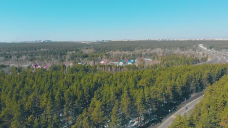 winding-roads-and-pine-forests-surround-cottage-village