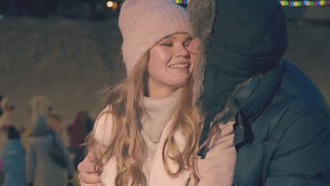cute-young-couple-has-fun-at-Christmas-fair-slow-motion