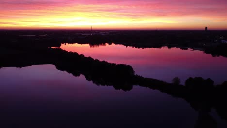 A-drone-lowers-over-the-sunset-reflection-in-the-waters-of-Mechels-Broek