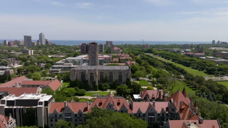 Rockefeller-Memorial-Chapel-and-the-Stuart-Hall,-at-the-University-of-Chicago,-USA---descending,-drone-shot