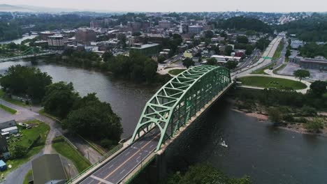 Aerial-view-of-Easton-PA-and-Delaware-River-establishing-shot-of-the-bridge-and-city