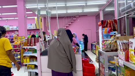 Situation-of-shopper-paying-at-the-cashier-in-a-supermarket,-Magelang,-Central-Java,-Indonesia