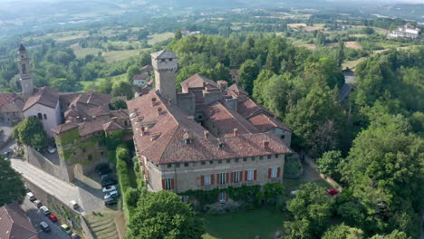 Castello-di-tagliolo,-Italian-castle-in-rural-north-Italy,-aerial-orbit-summer