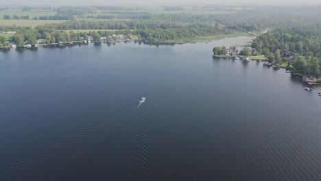 Aerial-View-Of-Boat-Cruising-On-The-Lake-In-Daytime
