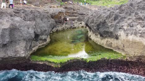 Aerial-view-of-Angel-Billabong,-a-natural-tidal-rock-pool-formation-in-Nusa-Penida-Island---Bali,-famous-Tourists-spot-for-swimming-and-Photos