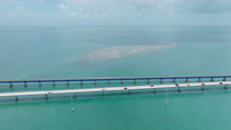 Aerial-tracking-shot-following-cars-along-the-Seven-Mile-Bridge-in-the-Florida-Keys