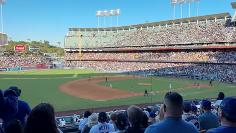 Baseball-Fans-Clapping-And-Celebrating-Big-Hit-At-Dodger-Stadium-On-Clear-Sunny-Day