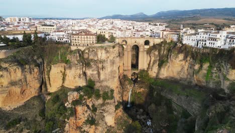 Ronda-Cityscape-and-Arch-Bridge-Puente-Nuevo-in-Malaga,-Andalusia,-Spain---Aerial