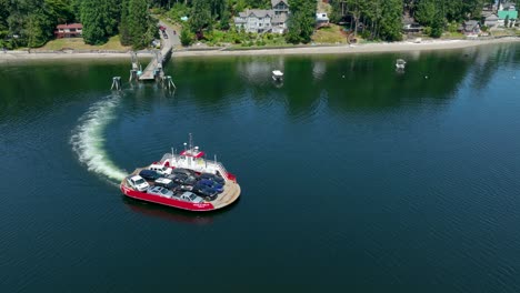 Aerial-view-of-a-modest-ferry-leaving-Herron-Island-in-the-Puget-Sound