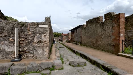 Empty-street-through-the-ruins-of-the-historical-city-of-Pompeii