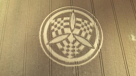 Aerial-view-descending-over-windy-South-Wonston-2023-propeller-chequered-crop-circle-blowing-golden-Hampshire-wheat-field