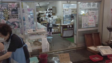 Elder-Woman-Sells-Fish-at-Local-Market-in-Obama-Japan,-Wakasa-Fisherman's-Store