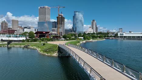 Pedestrian-bridge-over-Lake-Michigan-with-a-view-of-Milwaukee-skyline-and-downtown-skyscrapers