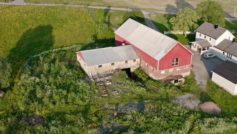 Aerial-Drone-View-Of-A-Huge-Barn-Farmhouse-In-Countryside