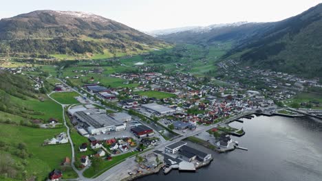 Town-of-Vik-in-Sogn-and-Fjordane-Norway---Evening-aerial-flying-backwards-from-town-to-over-Sognefjord-sea