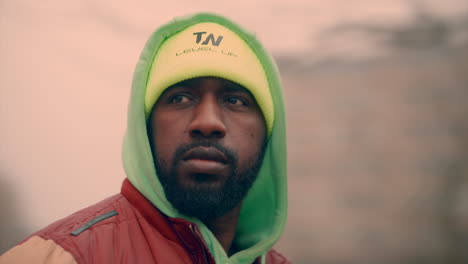 Epic-closeup-spinning-elips-gimbal-shot-of-a-black-man-with-great-depth-of-field-and-spinning-background-buildings