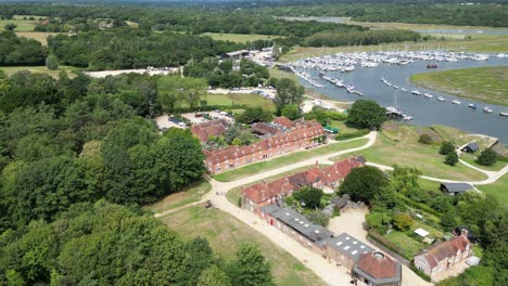 Establishing-aerial-shot-Bucklers-hard-Hampshire-Historic-ship-building-Village-UK-aerial